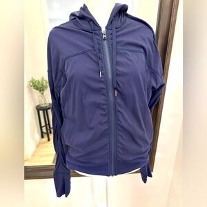 Lucy brand athletic jacket- stretch- Navy-Med. Rouching in front zipper/sleeves